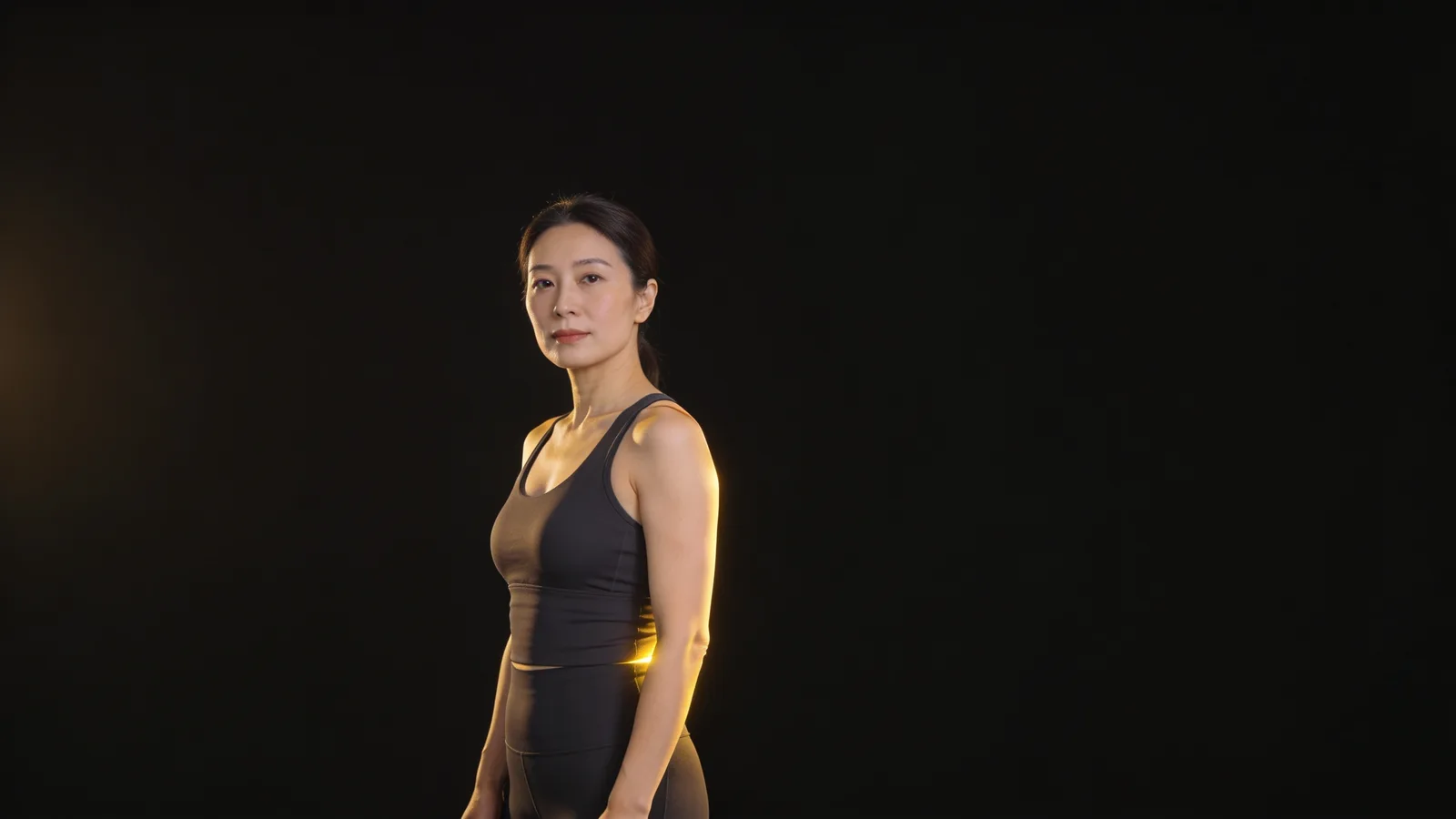 Illustrative model in athletic wear, full head in frame — not a patient