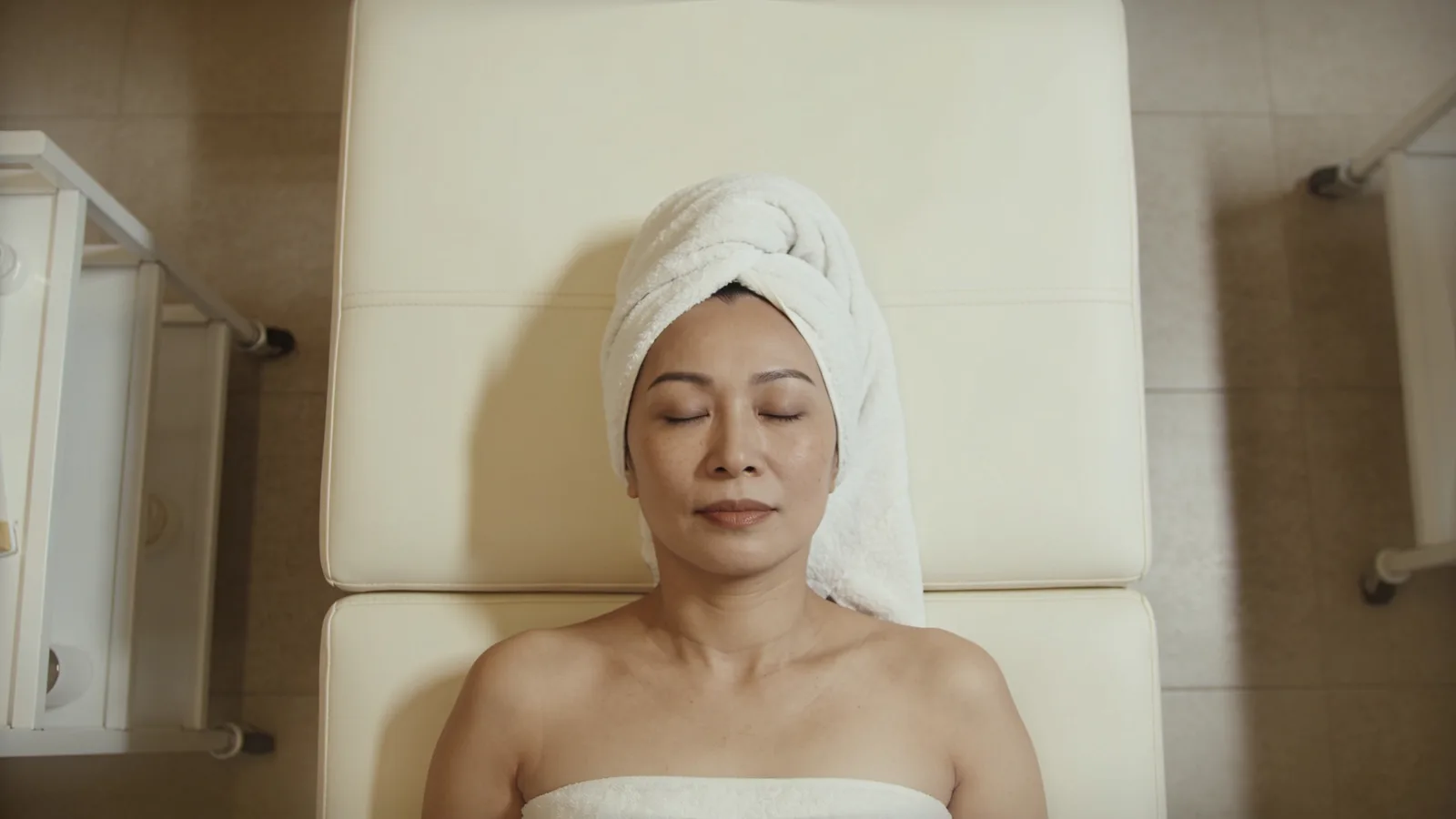 Illustrative model resting on a treatment couch — not a patient