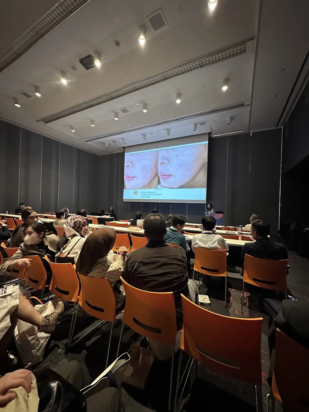 Taiwan doctors in the audience during the AMWC Asia-TDAC 2026 session, with a clinical slide on screen